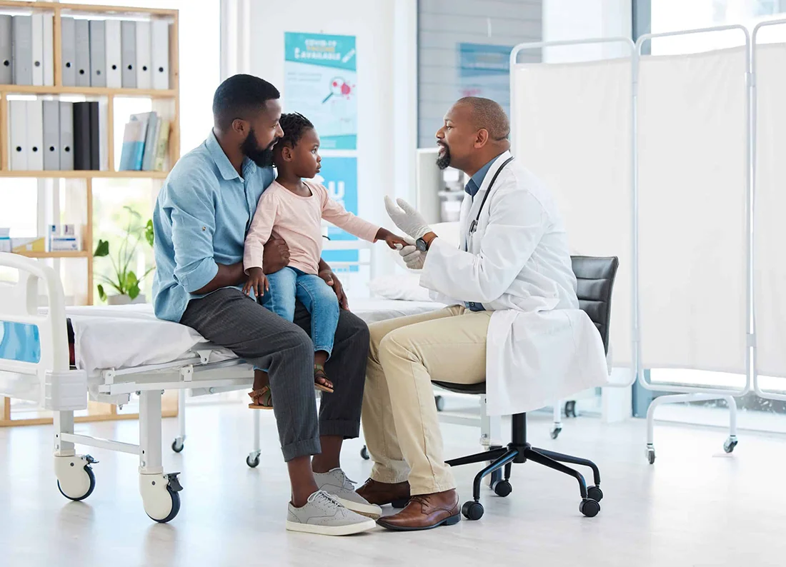 Pediatrician doctor consulting black kid patient for healthcare service, medical help and wellness check in hospital clinic Friendly, trust and kind african family gp expert for healthy child advice