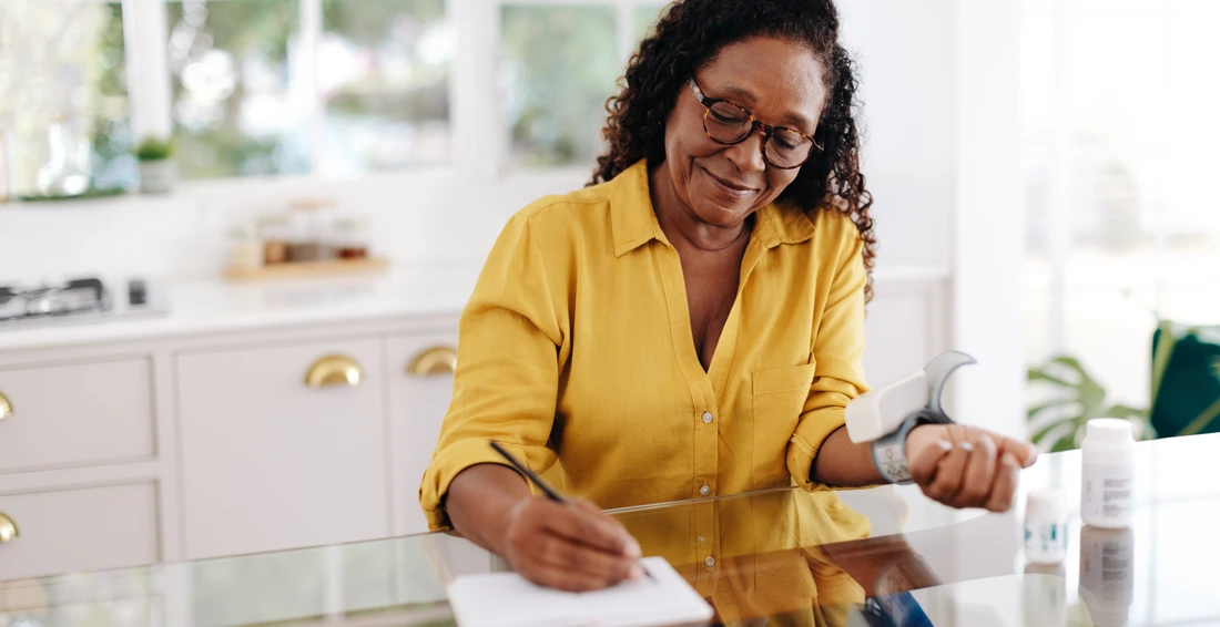 Aging woman recording and monitoring her blood pressure readings as part of her chronic disease management at home Hypertensive woman taking the necessary steps to maintain a healthy quality of life